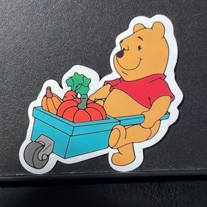 POOH BEAR WORKING IN THE GARDEN STICKER